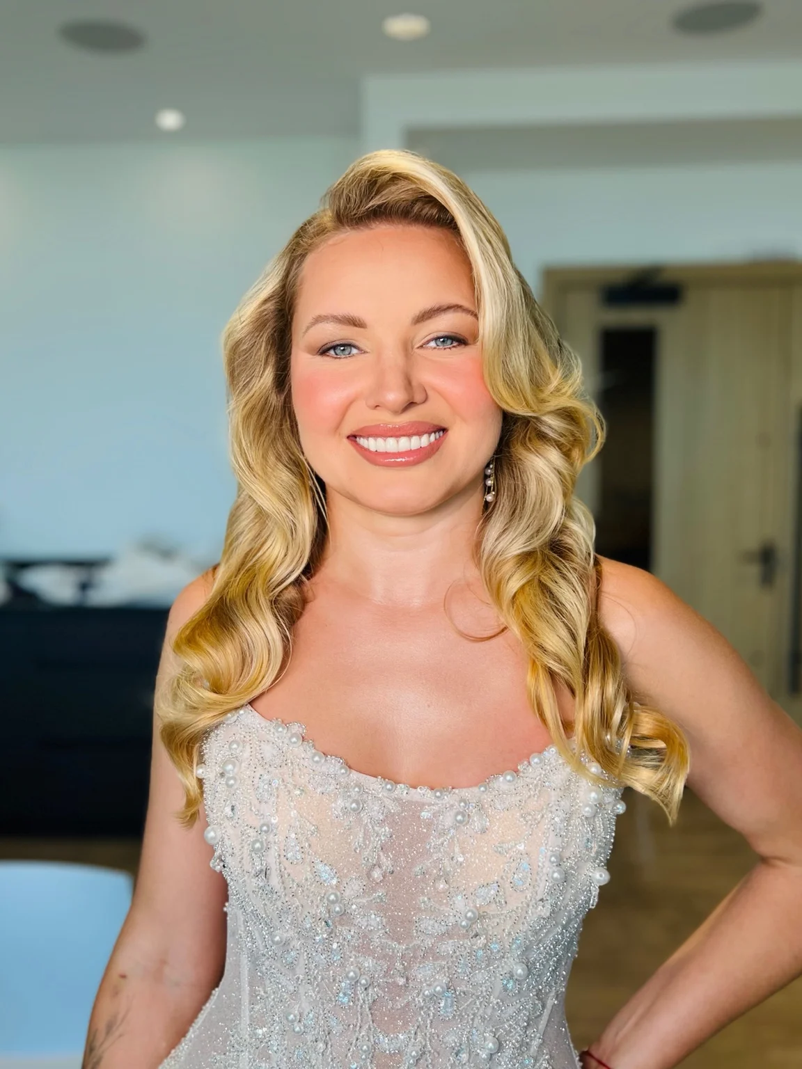 Radiant makeup and Hollywood waves